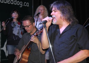 Against the Wind features lead singer David Forbes. Josh Gordon on acoustic guitar and backup singers Cyndi Richards and Amanda Rose (in white) as part of a 9-piece showband. -Gary 17