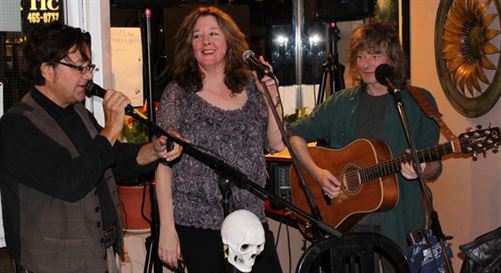 Robbie Belmore has Colleen McCullough and Kevin Bell's attention as he speaks during a gig with them in 2011 -Gary 17