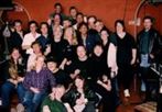 CCR group at Miguel's Bistro in 2002 -Dave Bailey is hoisting glass in second row from back.